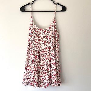 En créme floral tunic tank